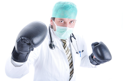 Young doctor with boxing gloves